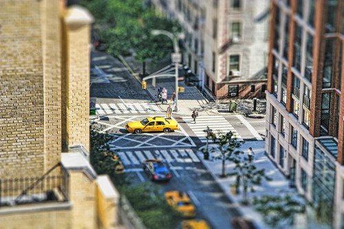 tilt shift of a yellow taxi cab in midtown manhattan new york city NYC